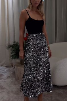 Sparkle and shine in our Glam High Rise Sequin Midi Skirt! This stunning piece features a high rise fit and intricate sequin detailing that adds a touch of glamour to any outfit. Stand out from the crowd and make a statement with this eye-catching skirt. Perfect for any special occasion, it's sure to turn heads and make you feel confident and stylish. Material:Cotton+Polyester+Sequin SIZE US/CAN BUST WAIST HIPS S 2-4 33"-34" 26"-27" 36"-37" M 6-8 35"-36" 28"-29" 38"-39" L 10-12 37"-39" 30"-32" 40"-42" XL 12-14 40"-42" 33"-35" 43"-45" Winter Mini Dresses, Sequin Midi Skirt, Sparkle And Shine, Black Midi Skirt, 70 Dress, Long Blouse, Hoodie Dress, Jumpsuit Dress, Dresses For Sale