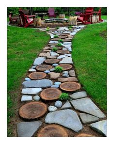 a stone path made out of logs with chairs in the background