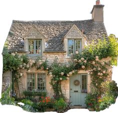 an old stone house with roses growing on it's front door and windows,