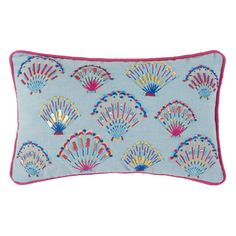 a blue pillow with colorful fan design on it