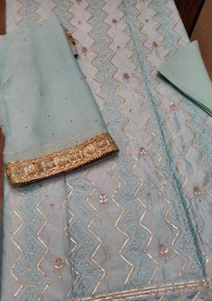 Item Overview ATHARVA Hand Embroidered Salwar Kameez in Blue w/Thread Jaal/ Elegant Hand Work/Gota Patti Border Dupatta/Customized Stitching/Wedding Dno. CH1249 Fabric:  * Shirt Chanderi 2.5 Mts, Blue Jaal Embroidery  * Dupatta: Pure Chiffon Chinnon Dupatta with Gota Patti work 2.5 Mts. * Bottom Santoon Silk 2.5 Mts. Excusive Hand Embroidered Party Wear Punjabi Suit. 🌷CUSTOMIZATION (No Extra Charges) * Fabrics Customization: Designs Can be made in different Fabrics. *Color Customization: Design Jaal Embroidery, Patiala Salwar Kameez, Embroidery Dupatta, Embroidered Salwar, Patiala Salwar, Embroidered Pants, Pure Chiffon, Punjabi Suit, Hand Work