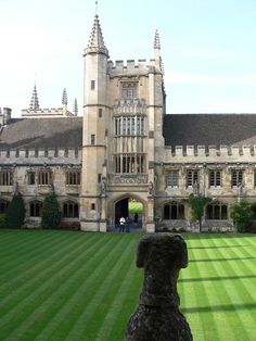 a large building with a lawn in front of it