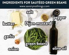 ingredients for sauteed green beans in a bowl next to a bottle of wine