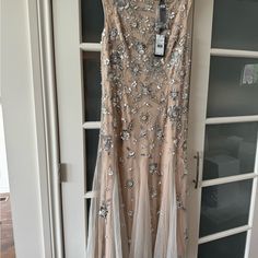 a dress hanging up on a door