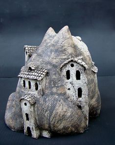 a rock with two houses built into it