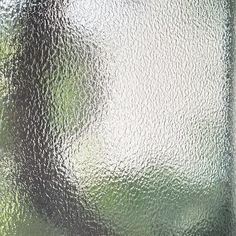 a close up view of a frosted glass window