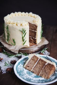 a slice of cake sitting on top of a plate next to a piece of cake