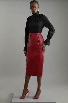 Experience Sleek Tailoring With Our Leather Pencil Skirt. Made With Supple Leather Fabric, A Tailored Fit And Military Button Detail, This Verstaile Midi Skirt Can Take You From Day To Night. Style With Knitwear Or Basic T-Shirt And Flats For A More Casual Look, Or Dress It Up With A Blouse And Heels. Leather Military Button Pencil Midi Skirt High Quality, Soft Real Leather Comfortable High Waistline Belt Loop Features Flattering Tailored Fit Military Button Detail Midi Length Chic High Waist Red Pencil Skirt, Red Pencil Skirt Outfit, Lady Illustration, Petite Wedding Guest Dresses, Leather Outfits Women, Plus Size Workwear, Pencil Midi Skirt, Skirt Collection, Red Pencil Skirt