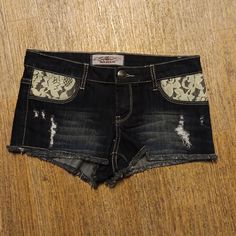 Iris Black Destroyed Jean Shorts Front Floral Lace Pockets Has Back Pockets Belt Loops Button And Zipper Closure Made Of 80% Cotton 18% Polyester 2% Spandex Size Junior M. Brand New Without Tag Black Shorts Jeans, Grunge High Rise Washed Black Jean Shorts, Y2k Black Jean Shorts, Black Grunge Jean Shorts, Washed Black Grunge Denim Shorts, Black Denim Punk Shorts, Grunge Shorts, Gothic Shorts, 80s Jeans