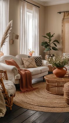 a living room filled with lots of furniture and decor on top of a wooden floor