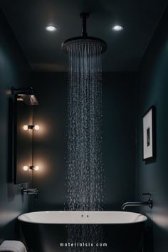 Modern bathroom with dark walls, a rainfall showerhead, and a illuminated bathtub beneath. Victorian Elements