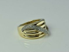 "14K Yellow Gold Diamond Set Swirl Ring, 4 part top serpentine, white gold top band diamond set with 2 rows of round solid shank, .5\" across top, Ring size 6.5, Circa 1990, 9.5 grams Stock # BB234R16 Most rings are sizable for a small fee. If the ring you are considering is the incorrect size contact us for a quote. This listing contains photographs of the actual item you will receive. Our items are in excellent condition with little or no signs of wear and many are one of a kind pre-owned esta Gold Coin Ring, Swirl Ring, Top Band, Coin Ring, Gold Top, Fine Jewelry Designers, Yellow Gold Earring, Diamond Set, Blue Topaz Ring