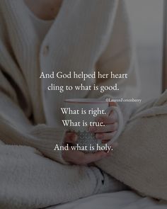 a woman holding a coffee cup in her hands with the words and god helped her heart cling to what is good