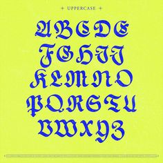 an uppercase alphabet in blue ink on a yellow background with the letters below it