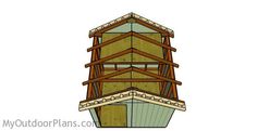 a drawing of a wooden structure with stairs on the top and bottom floor, in front of a white background