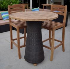 an outdoor table with four chairs around it