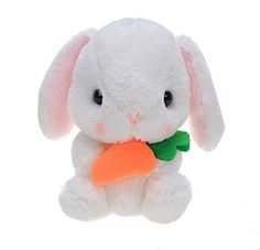 a white stuffed rabbit with a carrot in it's mouth on a white background