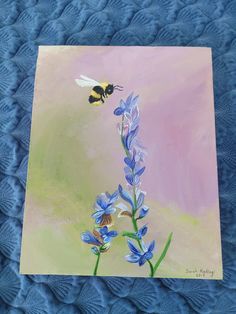 a painting of a blue flower with a bee on it