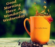 an orange coffee mug with the words good morning have a wonderful wednesday