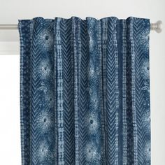 a curtain with blue and white designs on it