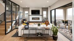 a living room filled with furniture and a fire place