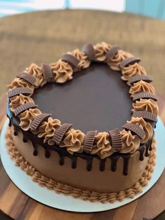 a chocolate cake sitting on top of a wooden table