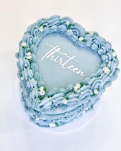 there is a heart shaped cake with the word tarteon written in frosting