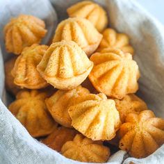 a bag full of small round cookies on top of a table