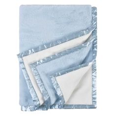 three blue and white blankets folded on top of each other