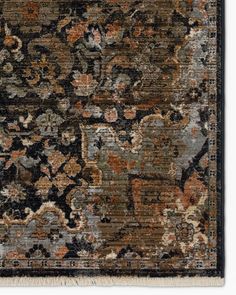 an area rug with many different colors and designs on the carpet, including black, brown, blue, orange and white