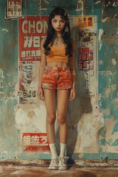 a woman standing in front of a wall with graffiti on it and wearing short shorts