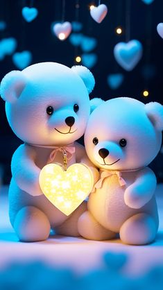 two white teddy bears holding a heart shaped light in front of some blue and white hearts