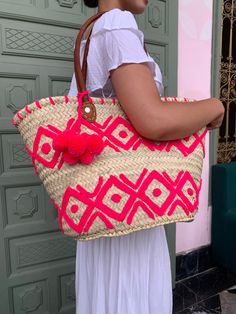 Please Check Our Straw Bags Unique Collection :  https://www.etsy.com/shop/BeLdiCountry?ref=seller-platform-mcnav§ion_id=34219098 A beautifully crafted basket to accompany you everywhere. It's a great basket for the beach or for shopping and will also make a great storage basket at home.  Each design is handmade and therefore completely unique. Approximate dimensions :  Length: 50 cm Height: 30 cm  Please note that as all our products are handmade, there may be slight variations in the dimensions of the baskets. Delivery is made worldwide by FEDEX Priority express and registered mail 3-5 Business days  For each shipment, a tracking number of your package will be sent to you immediately. You will find it in the tracking of your order on Etsy and will be able to follow your shipment at any t Handmade Red Bucket Bag For Summer, Red Handmade Bucket Bag For Beach, Pink Bucket Bag With Braided Handles In Tote Shape, Pink Bucket Bag With Braided Handles, Pink Tote Bucket Bag With Braided Handles, Bohemian Pink Bucket Bag For The Beach, Bohemian Pink Bucket Bag For Beach, Pink Bohemian Bucket Bag For The Beach, Summer Bohemian Pink Bucket Bag