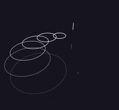 three circles are shown in the middle of a black background with white lines on it