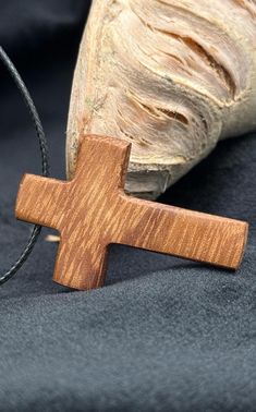 Mahogany Unique Wooden Cross Necklace. Handcrafted with Faith & Love. Christmas, Communion, Confirmation, Easter Gift Totally waterproof, sweat and (most) chemicals proof too. Completelly safe for wearing, both cross and necklace Necklace is from polyester waxed rope with self adjusting nodes. Lenght is self adjustible from 45 cm to 70 cm Dimension of cross pendant: 3,8x2,4 cm(1,49x0,94 inches) Symbolism: In various cultures, mahogany symbolizes strength and resilience, often linked to its histo Wooden Cross Necklace, Faith Love, Wooden Cross, Love Christmas, Faith In Love, Reddish Brown, Beautiful Furniture, Easter Gift, Elegant Gift