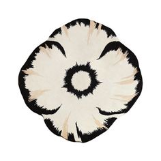 a black and white rug with an abstract design on the bottom, in front of a white background