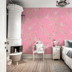 a bedroom with pink wallpaper and white furniture