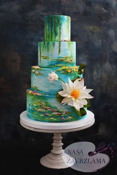 a three tiered cake decorated with water lilies