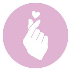 a hand holding a heart in the middle of it's fingers, with a pink circle