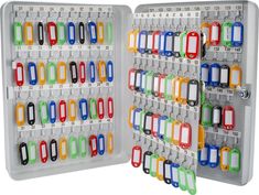 an open plastic storage box filled with lots of keys