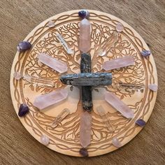 a wooden plate topped with lots of different types of rocks and stones on top of it