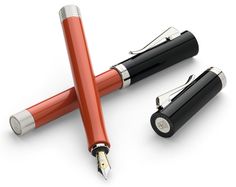 three fountain pens sitting next to each other