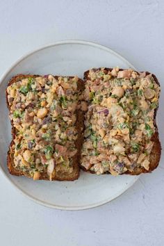 two pieces of bread on a white plate