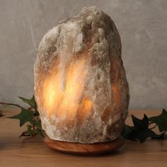 a rock lamp sitting on top of a wooden table