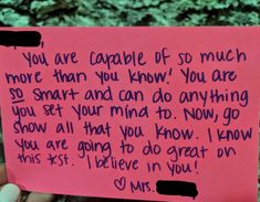 someone holding up a pink piece of paper with writing on it that says, you are capable of so much more than you know