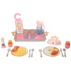 a toy breakfast set with eggs, toast and juice