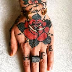 a hand with a rose tattoo on it and the word hope written in small letters