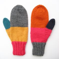 two knit mittens sitting next to each other