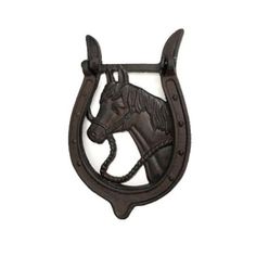 a horse head hanging from the side of a metal wall hook on a white background