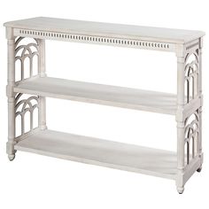 a white shelf with two shelves on each side and an arched design at the top